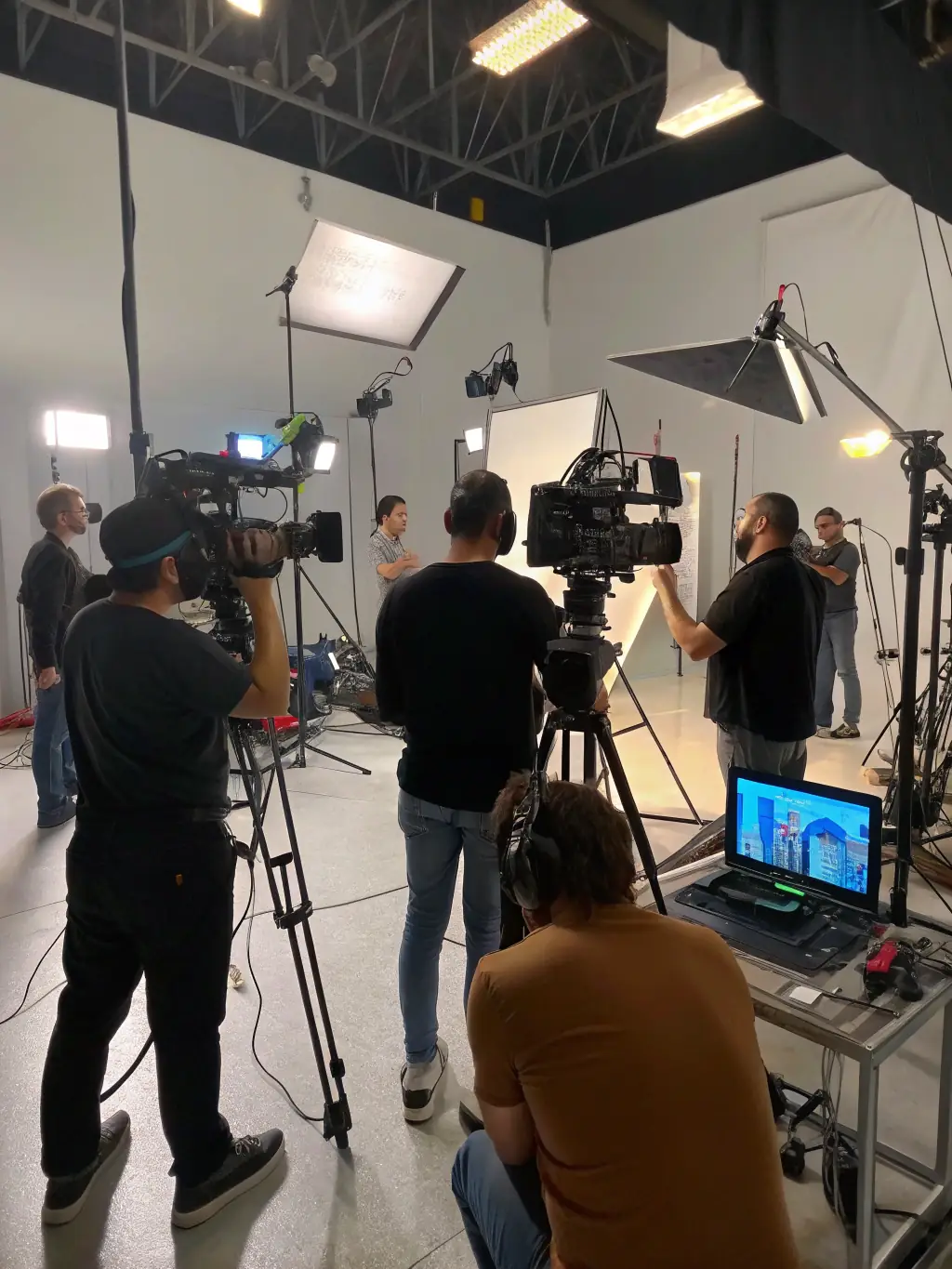 A behind-the-scenes image of a film crew setting up for a digital campaign shoot, highlighting the technical expertise involved.